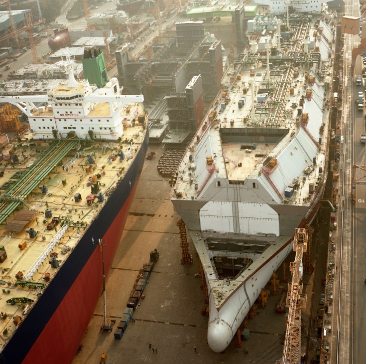 Aerial view of DSME shipyard showing a very large crude oil carrier and large LNG carrier under construction in the No.1 Dock.