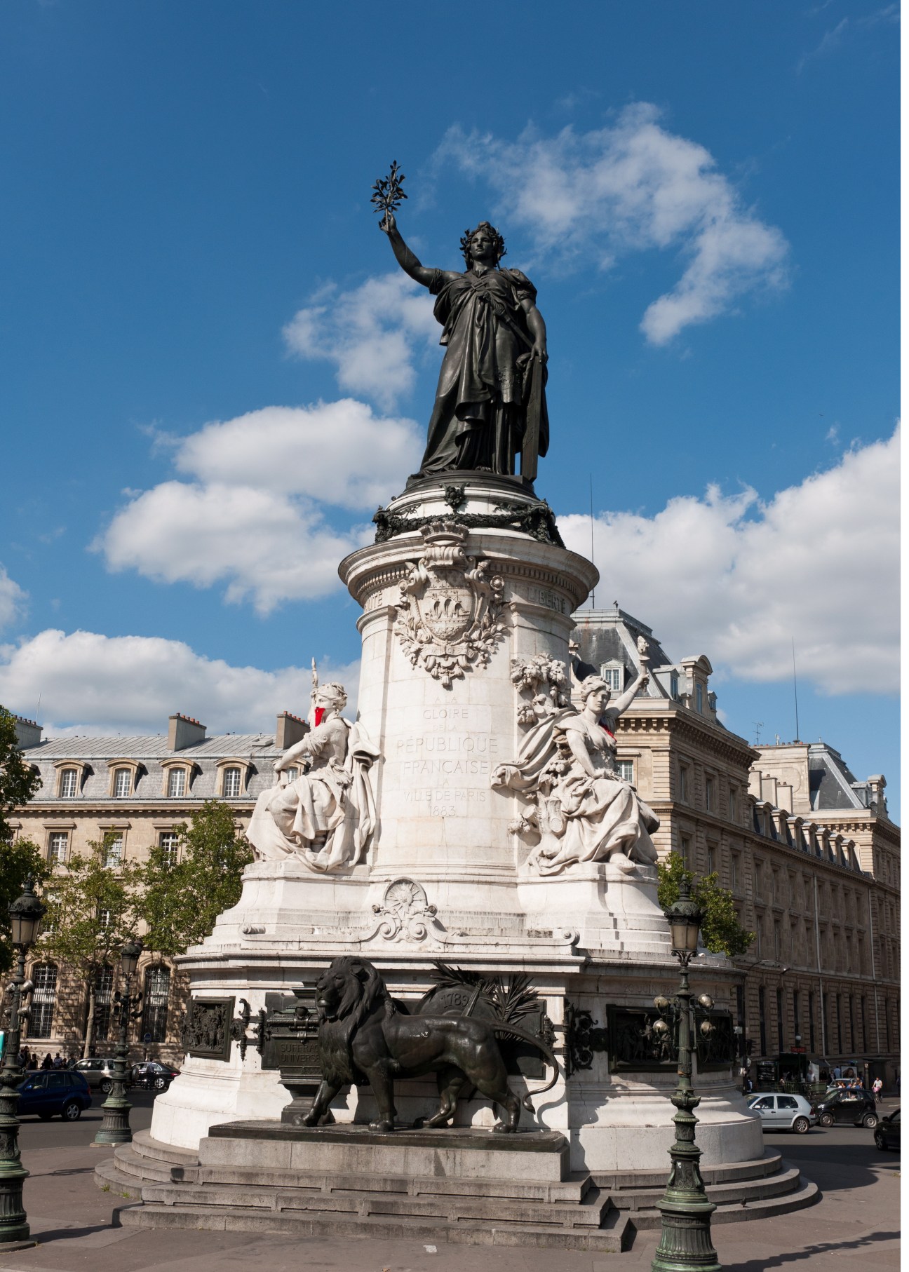 The central monument in Paris's Place de la République featuring a bronze elephant sculpture and a statue of Marianne holding a torch.