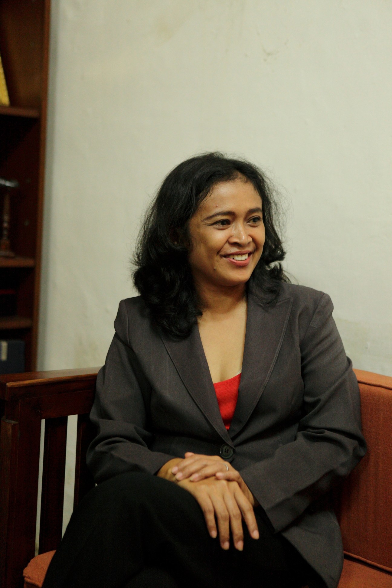 Yunastuti Daud from Yogyakarta Chamber of Commerce smiling while seated indoors