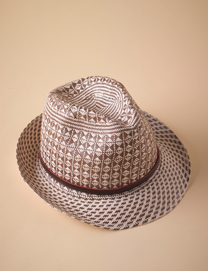 Woven straw hat with geometric patterns and a dark red ribbon band by Raffaello Bettini.