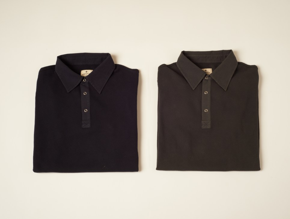 Two dark ribbed wool polo shirts displayed flat against a neutral background.