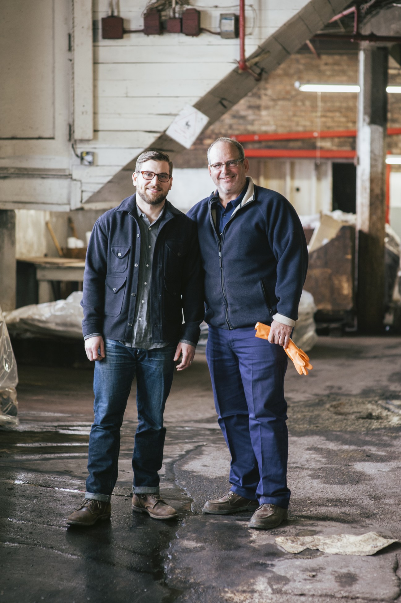 Arnold 'Skip' Horween and his son Nick stand together inside the Horween Leather Company factory in Chicago.