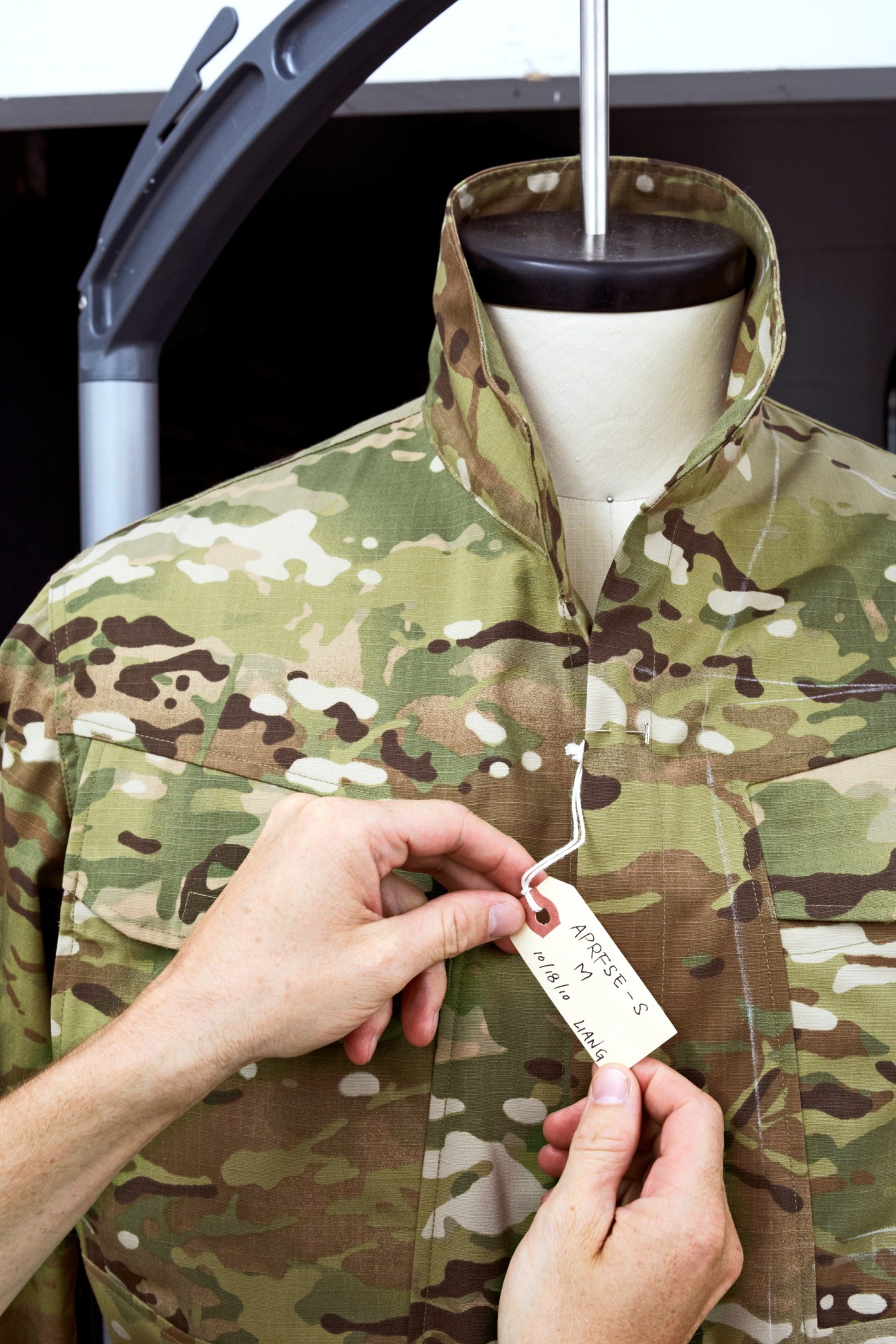Crye Precision G3 Field Shirt in MultiCam pattern being tagged on a dress form.