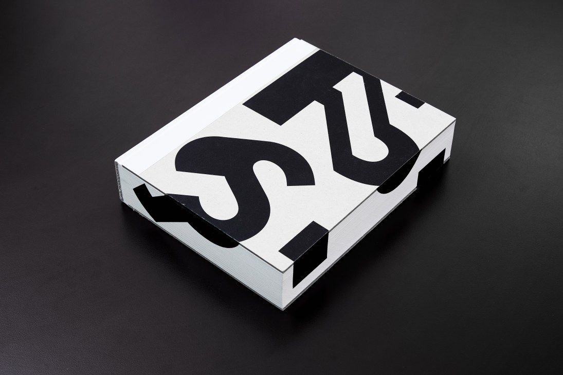 White box with bold black geometric typography displaying 'Paula Scher: Works' title.
