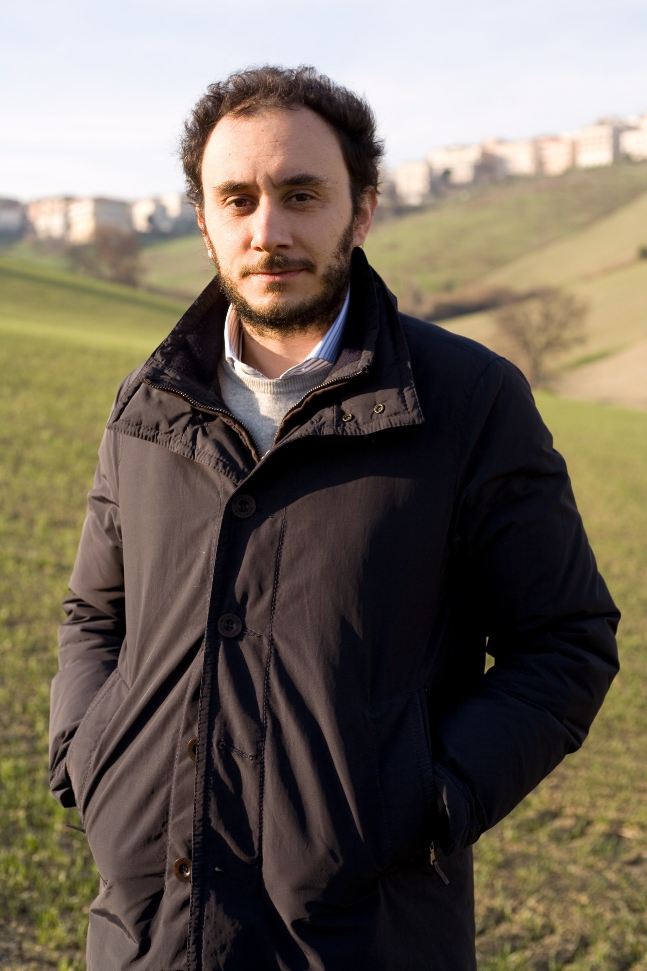 Franco Gazzani, co-founder of Bontoni shoes, stands in a field in Montegranaro, Italy.