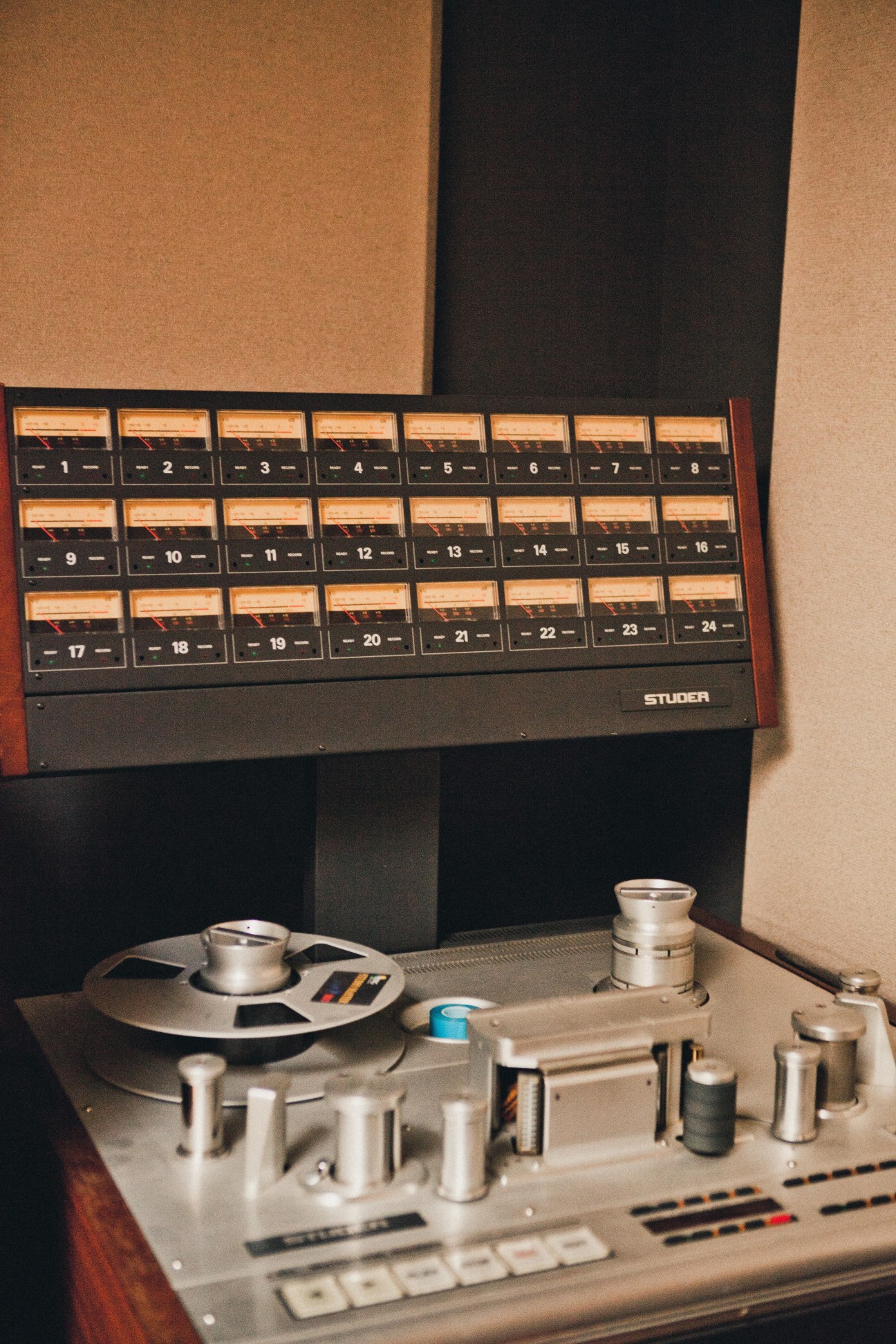 David Bowie's vintage reel-to-reel tape recorder with Studer mixing console in background.