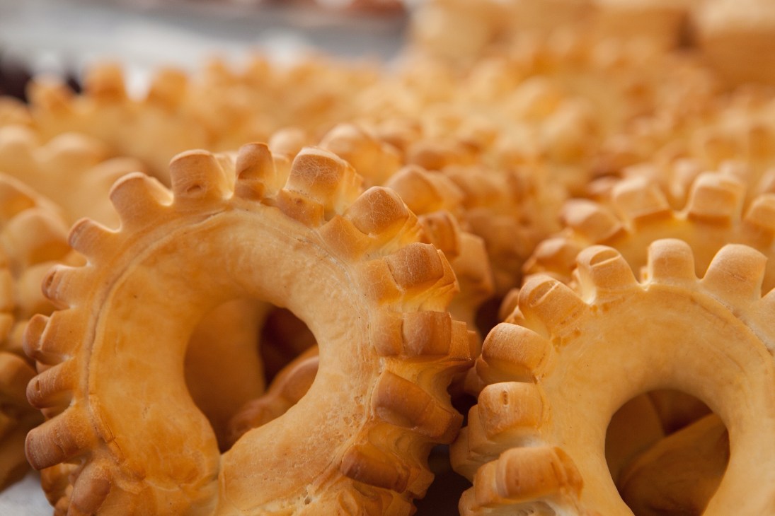 Close-up of wooden carved decorative objects with gear-like details.