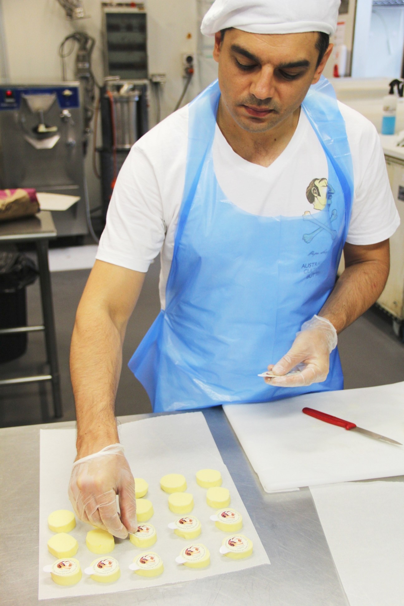 Pierre Issa in his Sydney factory arranging small portions of Pepe Saya artisanal butter.