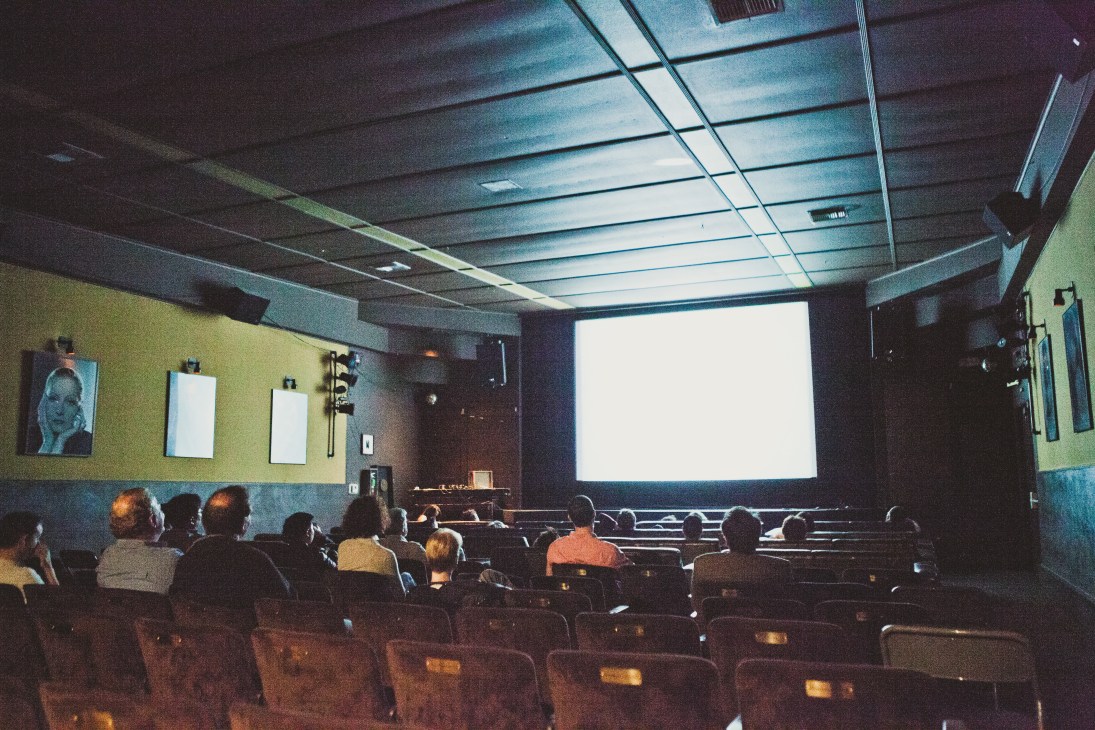 Audience members watching a film in Cinefamily cinema during a screening.