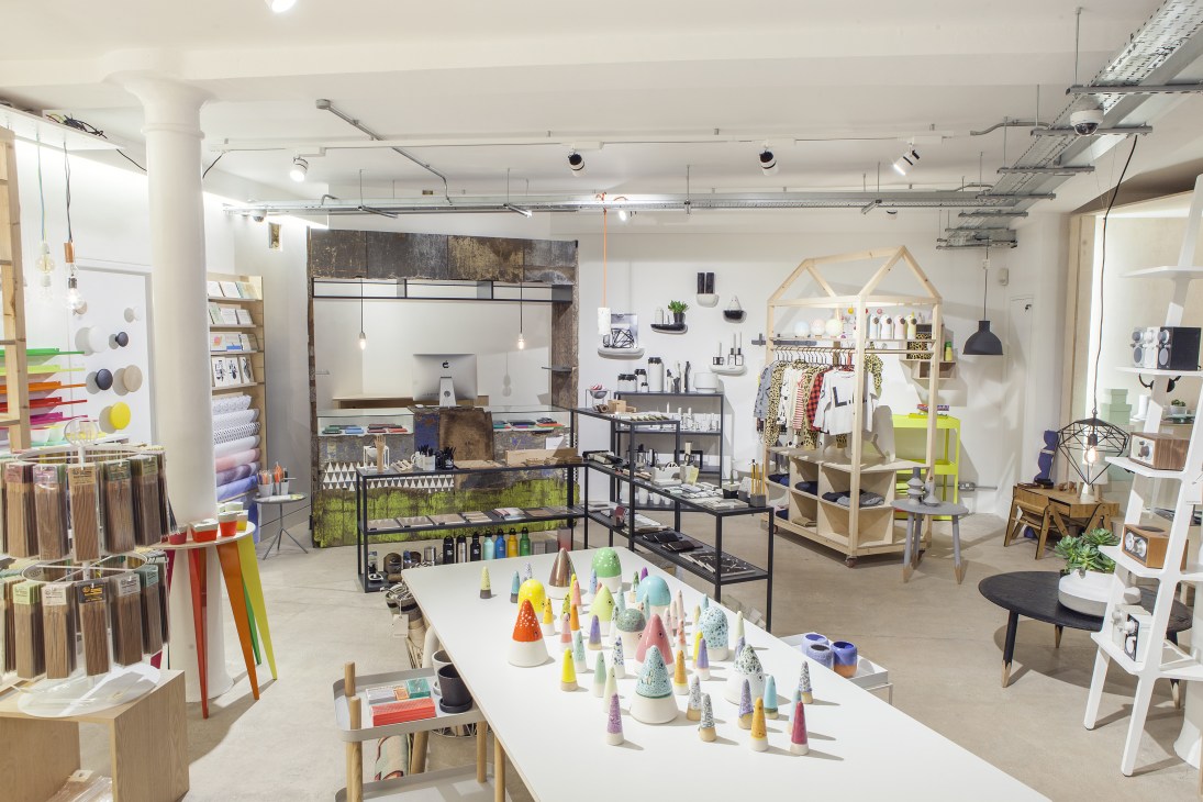 Interior of The Goodhood Store in London showing retail display with clothing, homeware and grooming products across two storeys.