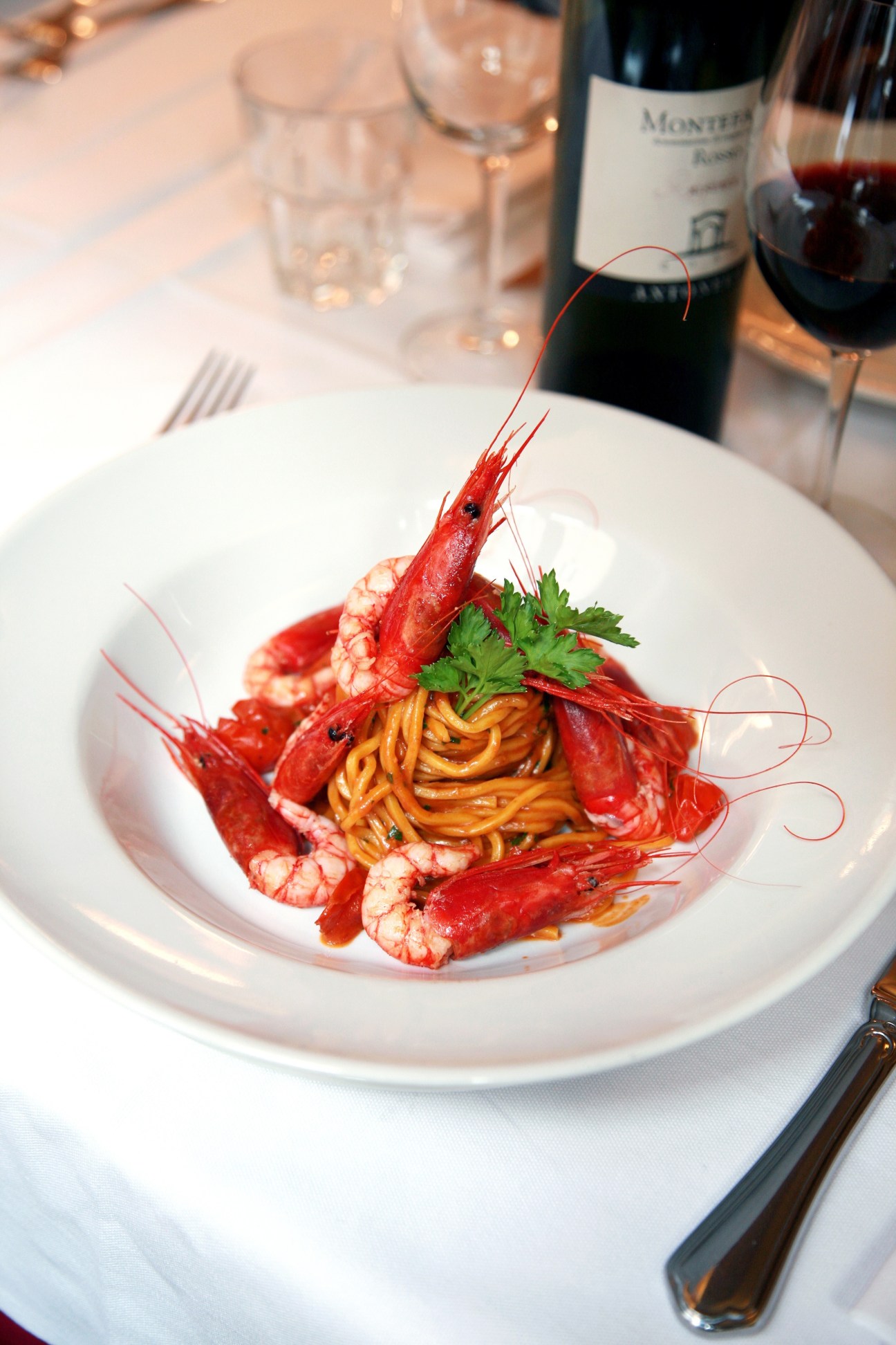 Red shrimp tonnarello pasta dish at Metodo Classico restaurant in Rome.
