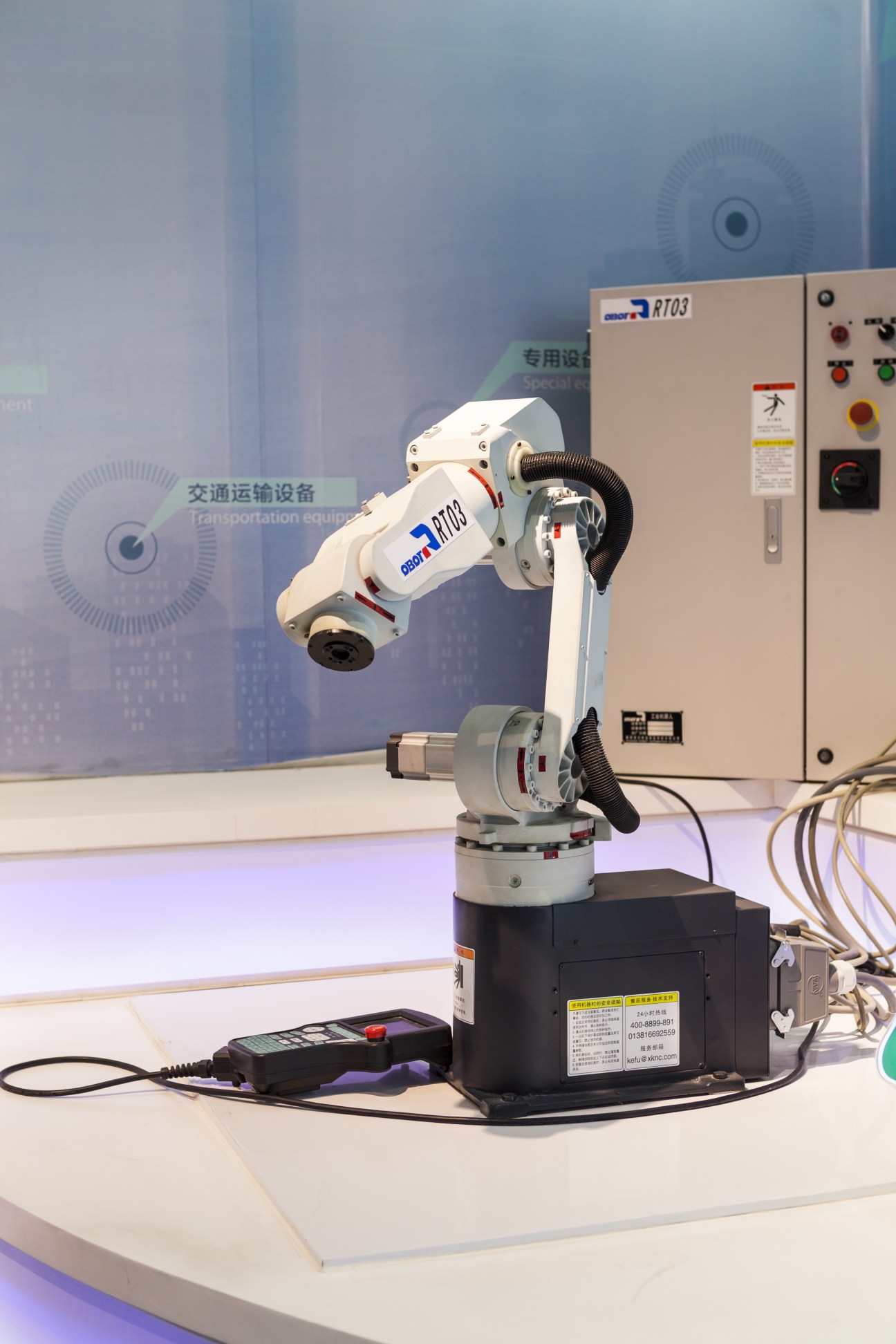 Industrial robotic arm displaying Microwise Systems monitoring technology at Xi'an Hi-Tech Development Zone.