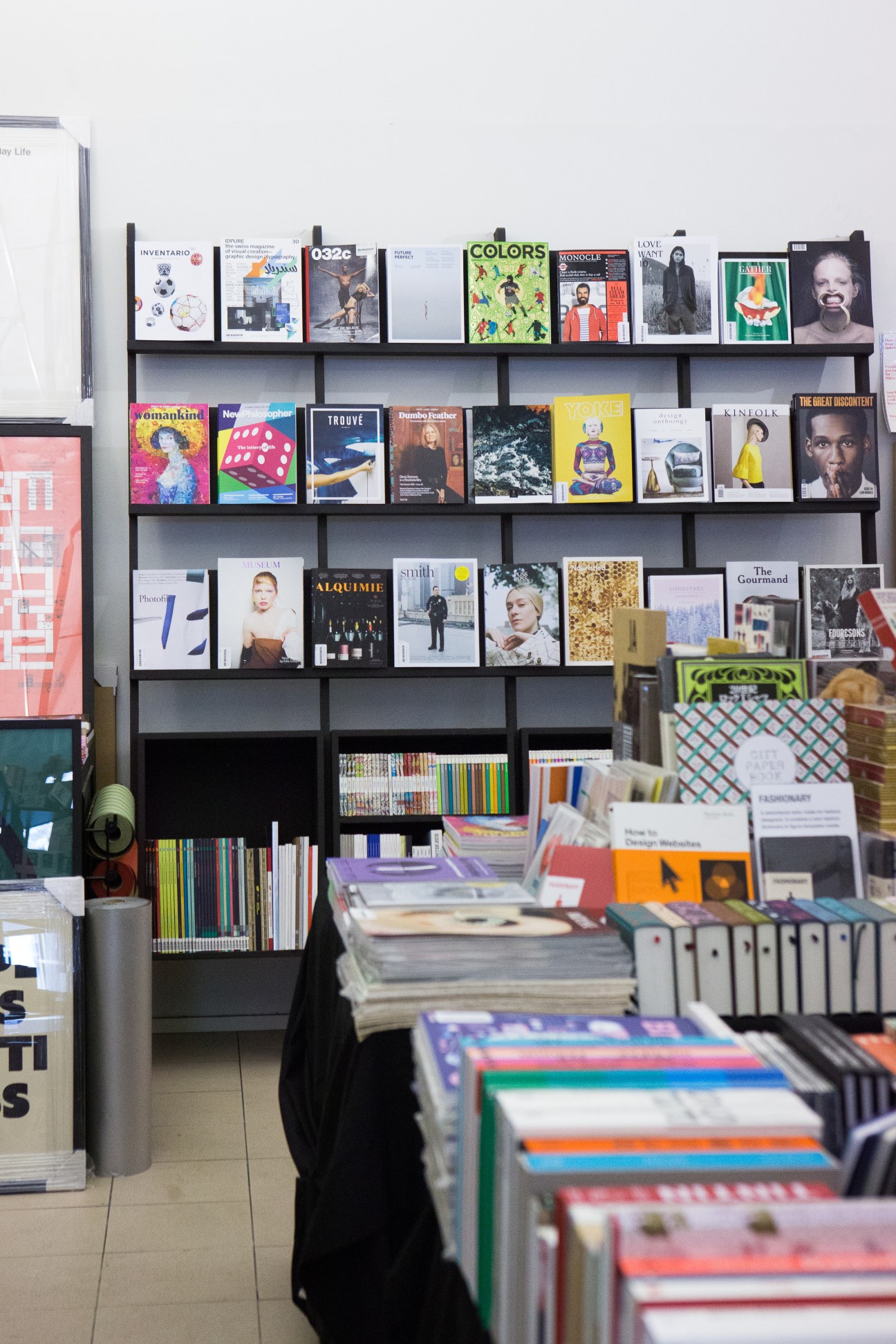 Interior of Beautiful Pages bookshop showing wall shelves displaying magazines and publications with books and products in foreground.