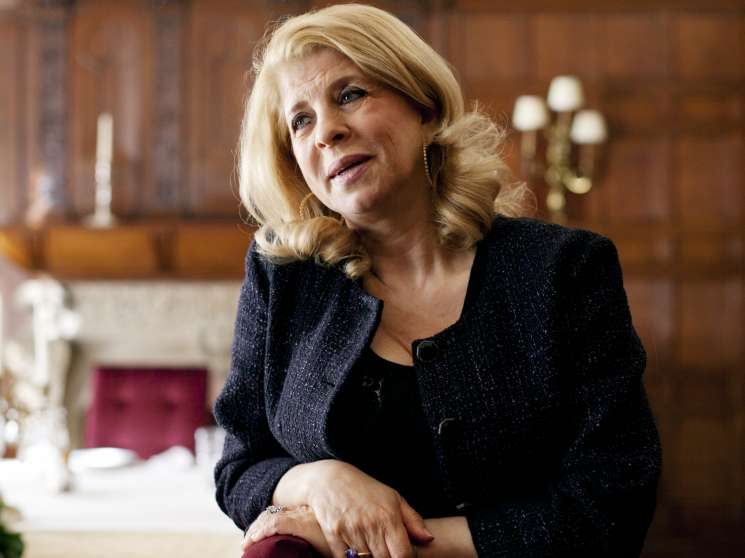 Inaam Osseiran, Lebanon's ambassador to London, sits in the embassy's wood-paneled interior.