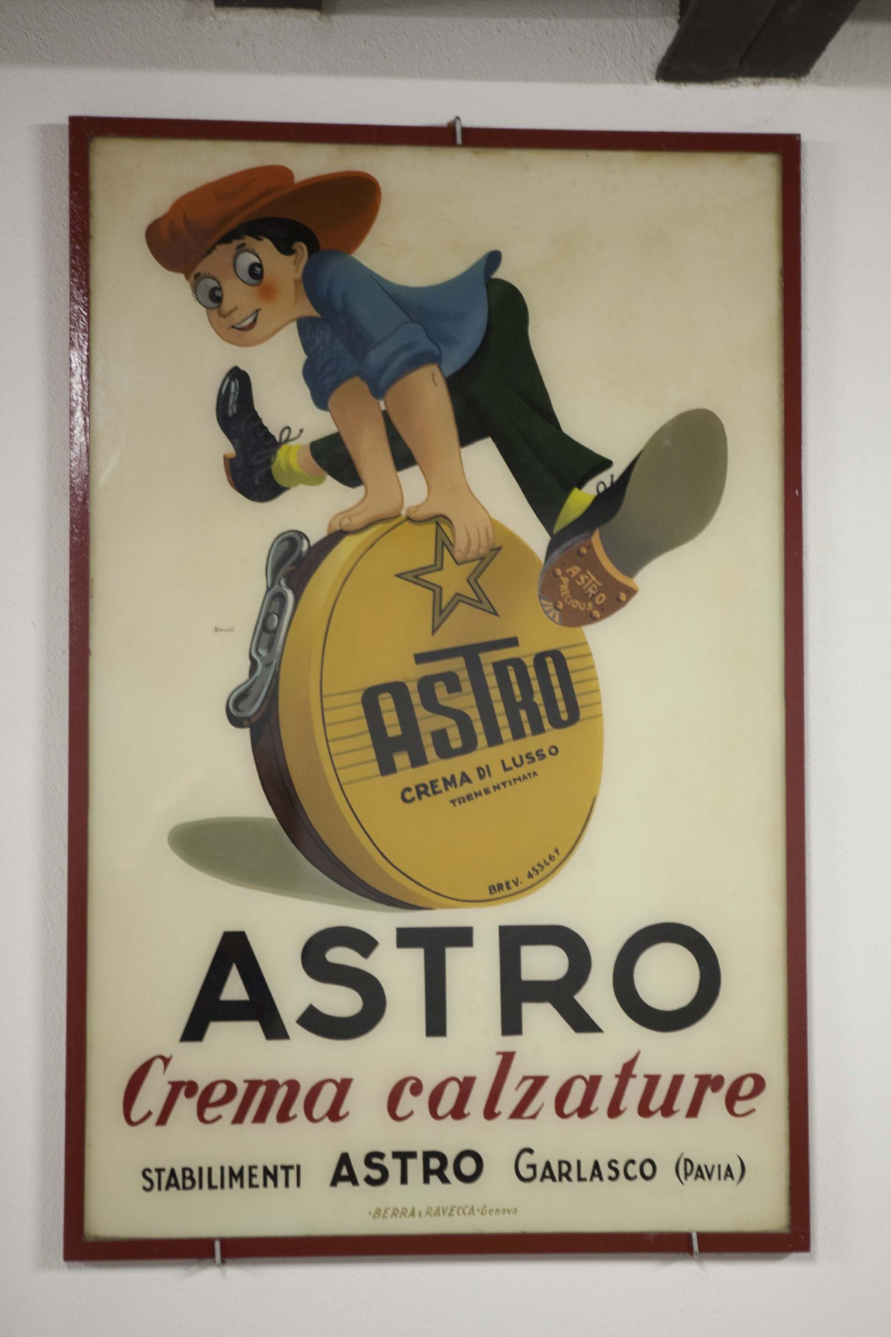 Vintage poster for Astro shoe cream featuring a cartoon cowboy character riding a yellow product container.