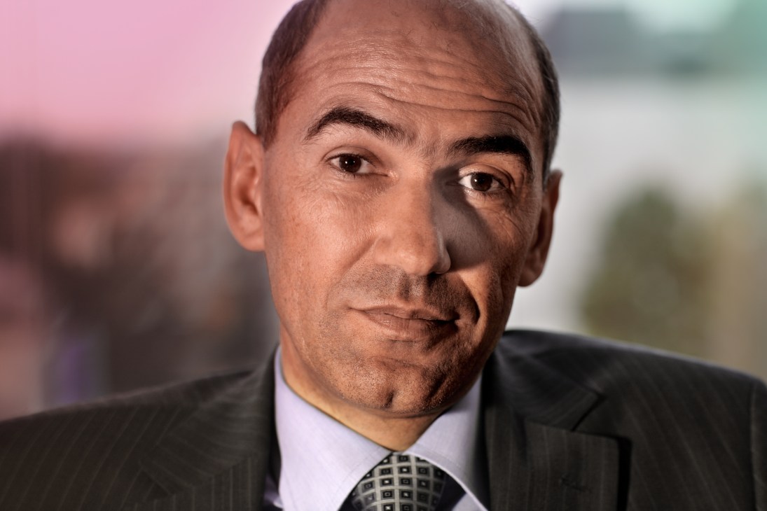 Portrait of Prime Minister Janez Janša wearing a dark suit and patterned tie.