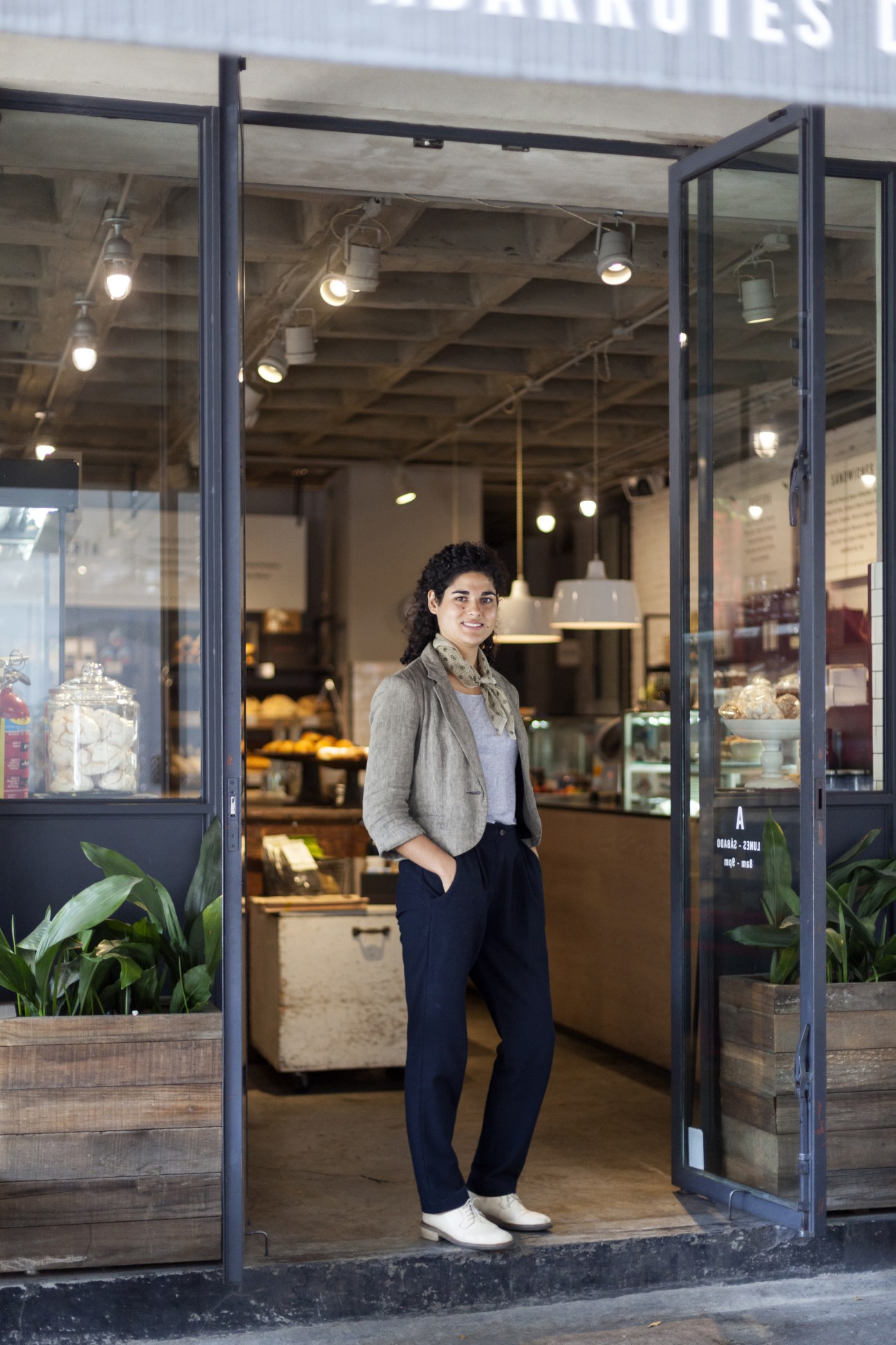 Micaela Miguel stands in the doorway of her Abarrotes grocery store in Mexico City's Roma neighbourhood.