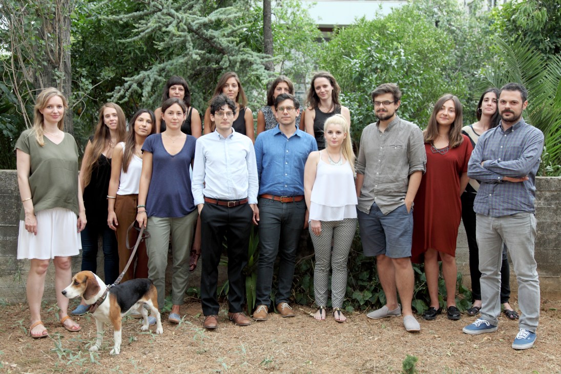 K-Studio team of architects posing together outdoors with greenery in background