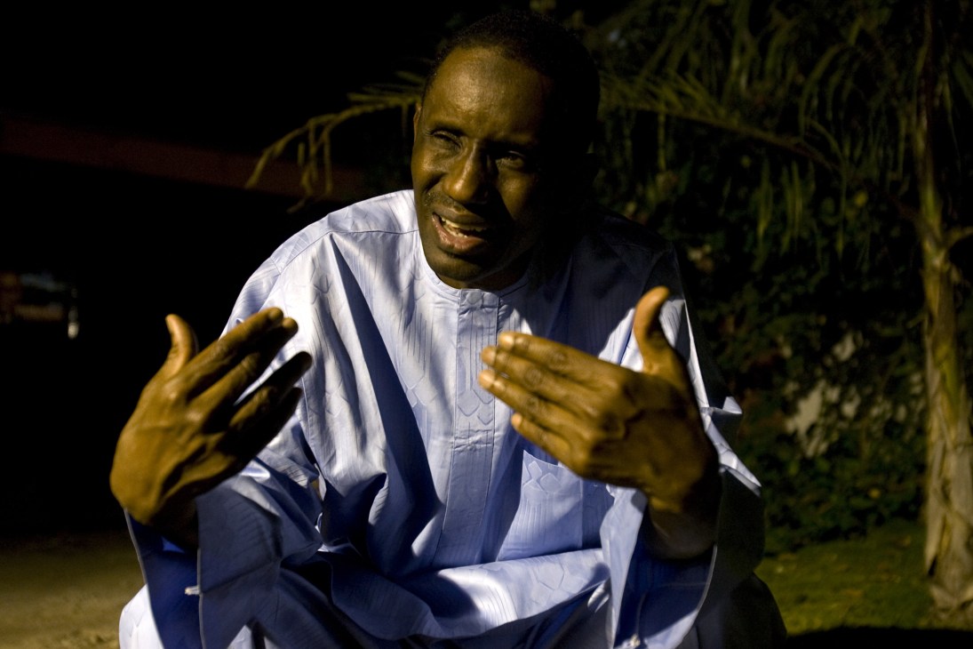 Nuhu Ribadu, Nigerian anti-corruption chief and presidential candidate, gestures while speaking outdoors at night.
