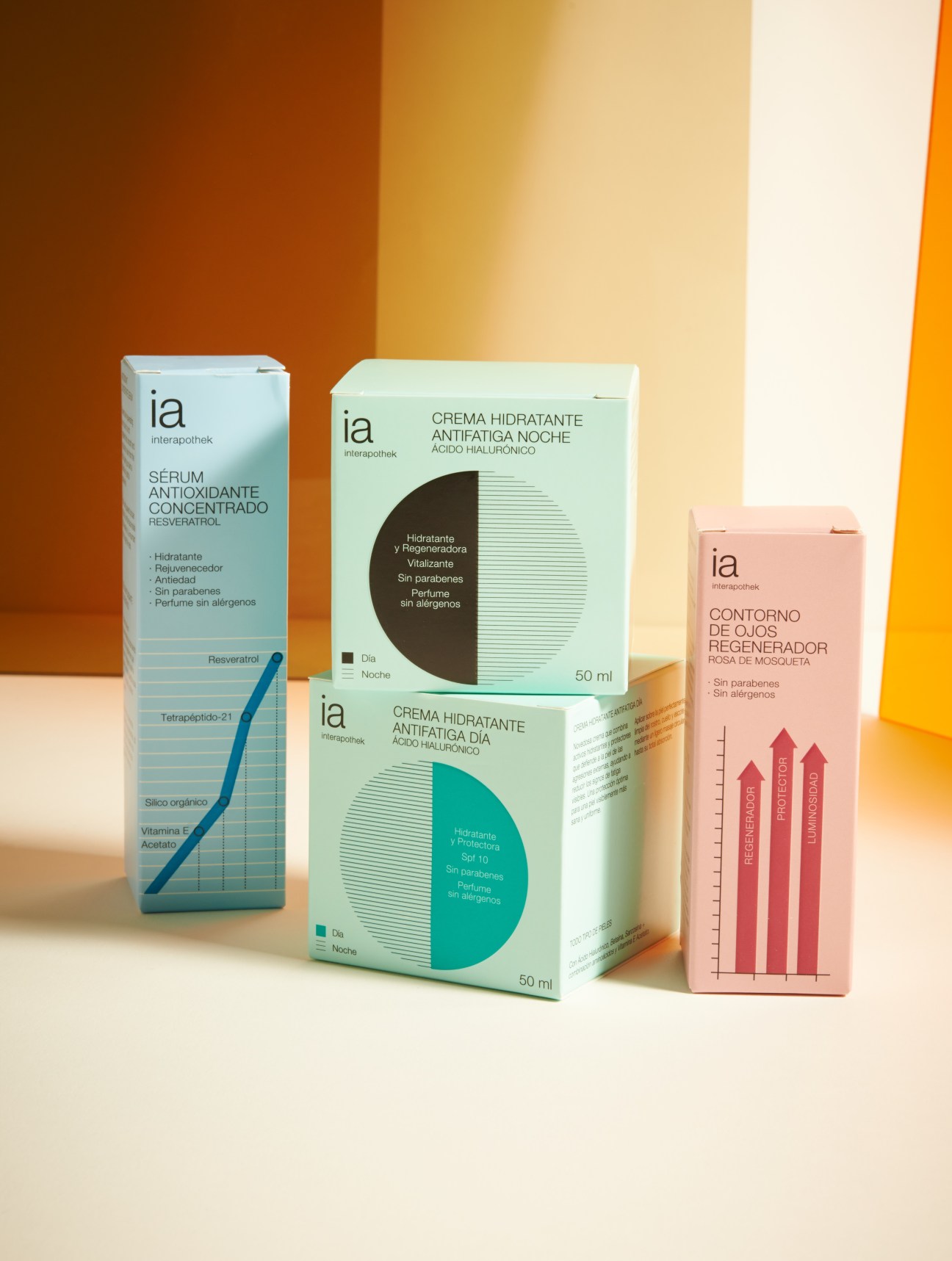 Interapothek skincare products with colorful packaging arranged against a gradient background.