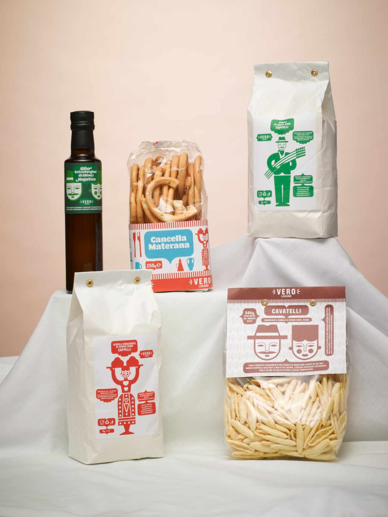 Vero Lucano Italian food products including olive oil, pasta, biscuits and flour in retro-style packaging.