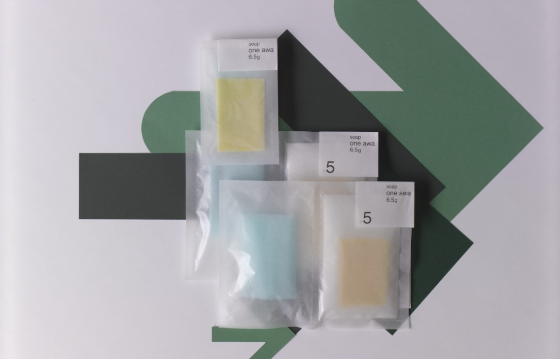 Inframince ultra-thin soap slivers in pastel colors packaged in clear plastic with white labels.