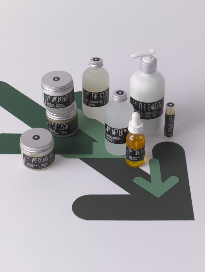 Belmondo organic cosmetics with olive oil ingredients displayed on geometric green and black shapes.