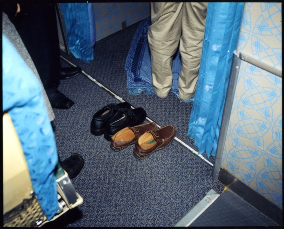 Passengers' shoes lined up outside the prayer room on IranAir Flight 744.