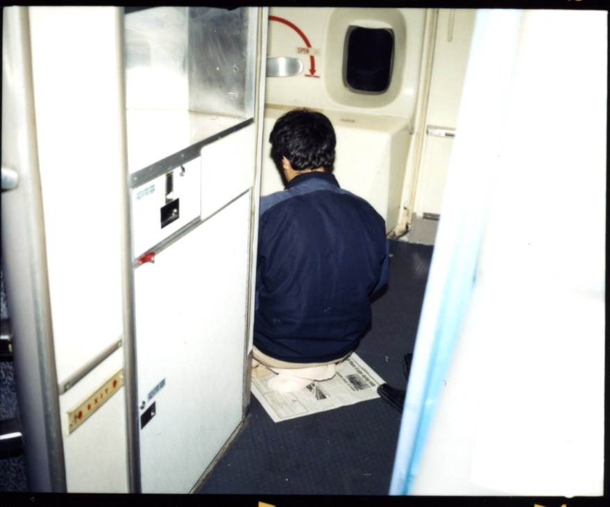 A passenger praying in the on-board prayer room of IranAir Flight 744.