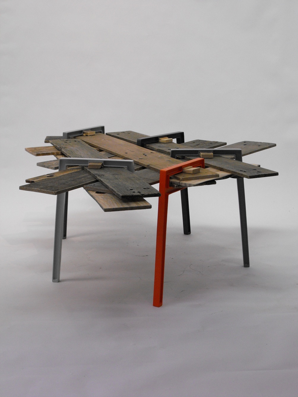 Modern table with reclaimed wood top and cast-aluminium image by David Amar titled Raymond.