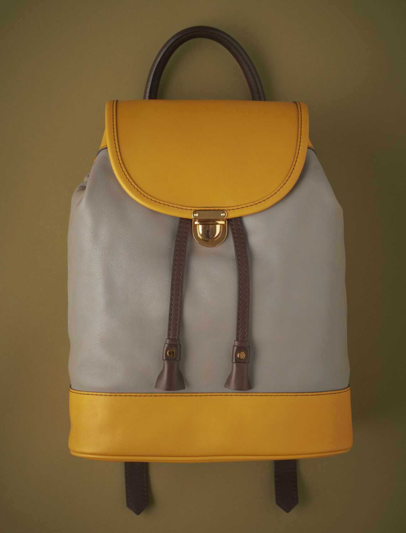 Ghongjord leather backpack with yellow and cream color-blocking and brown handles