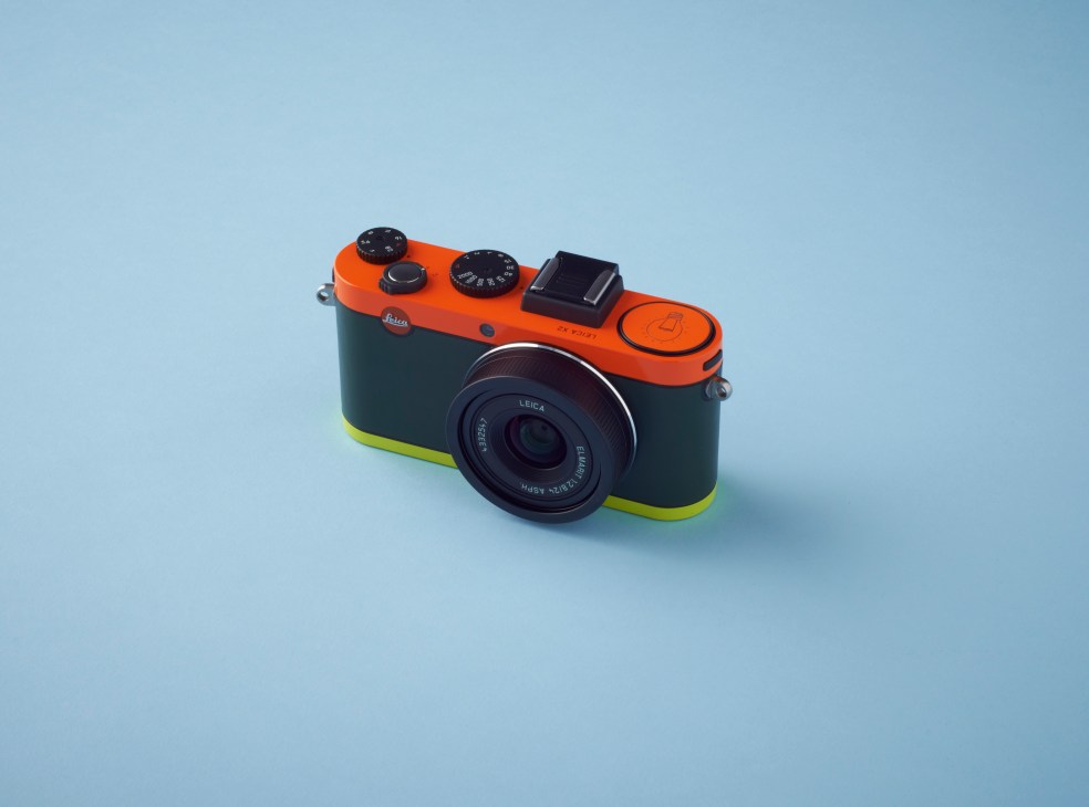Paul Smith customized Leica X2 compact camera in orange, black and neon yellow.