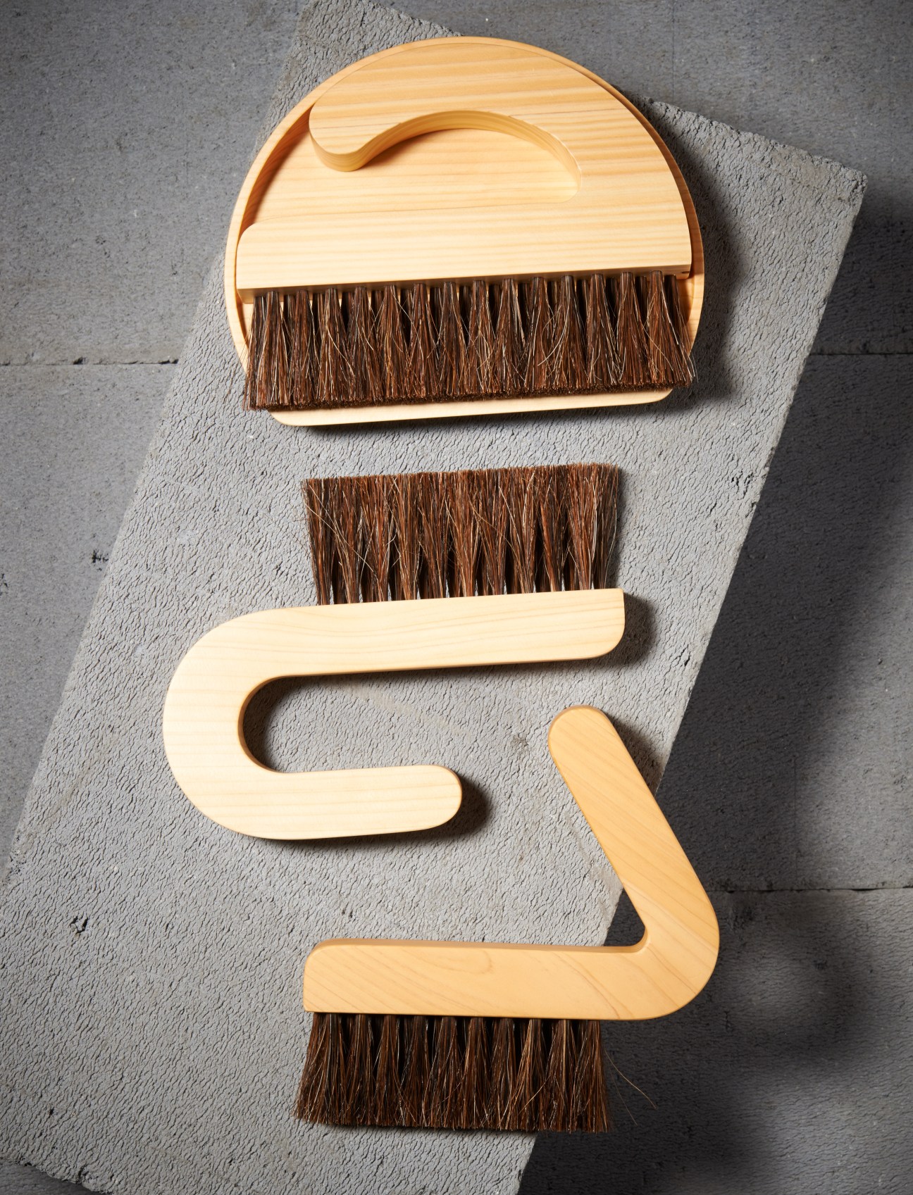Asahineko wooden dustpan and brush set in three shapes made from arborvitae and cypress wood.