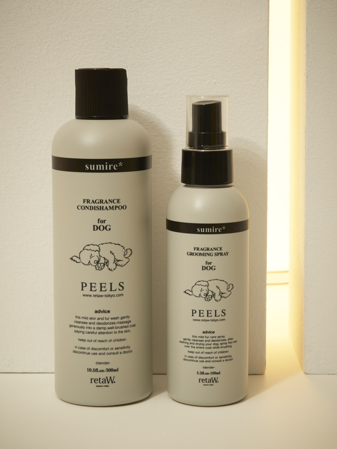 Two bottles of Peels dog grooming products by Sumire: a fragrance condishampoo and fragrance grooming spray.