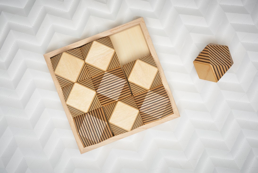 Full Swing wooden-block puzzle game with paper-plywood layered pieces in light and dark striped patterns.