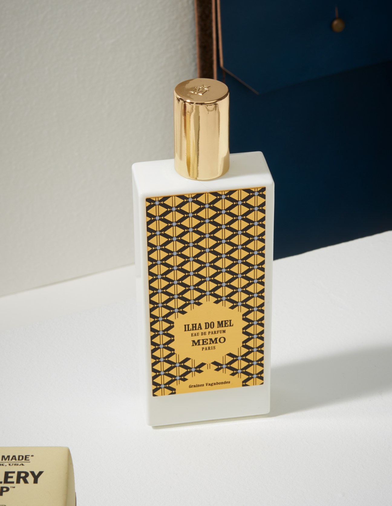 Memo Paris Ilha do Mel fragrance bottle with geometric patterned label and gold cap.