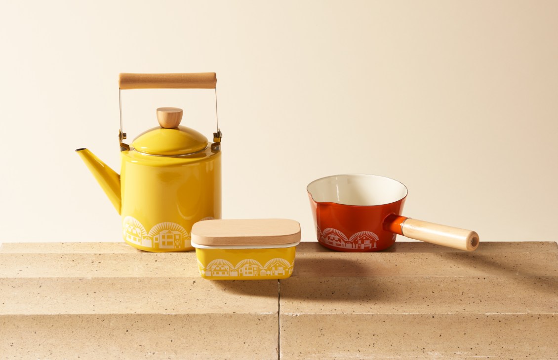 Mini Moderns Scandi-influenced enamelware set with yellow teapot, red pot, and matching container on neutral background.