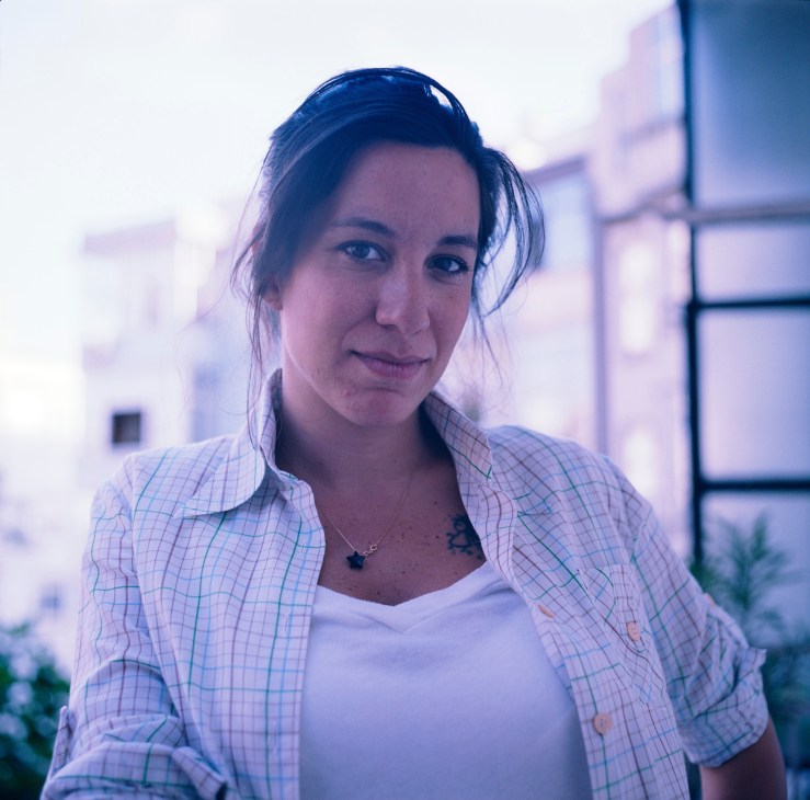 Melis Alphan, a columnist for Istanbul's Hürriyet newspaper, poses for a portrait outdoors.