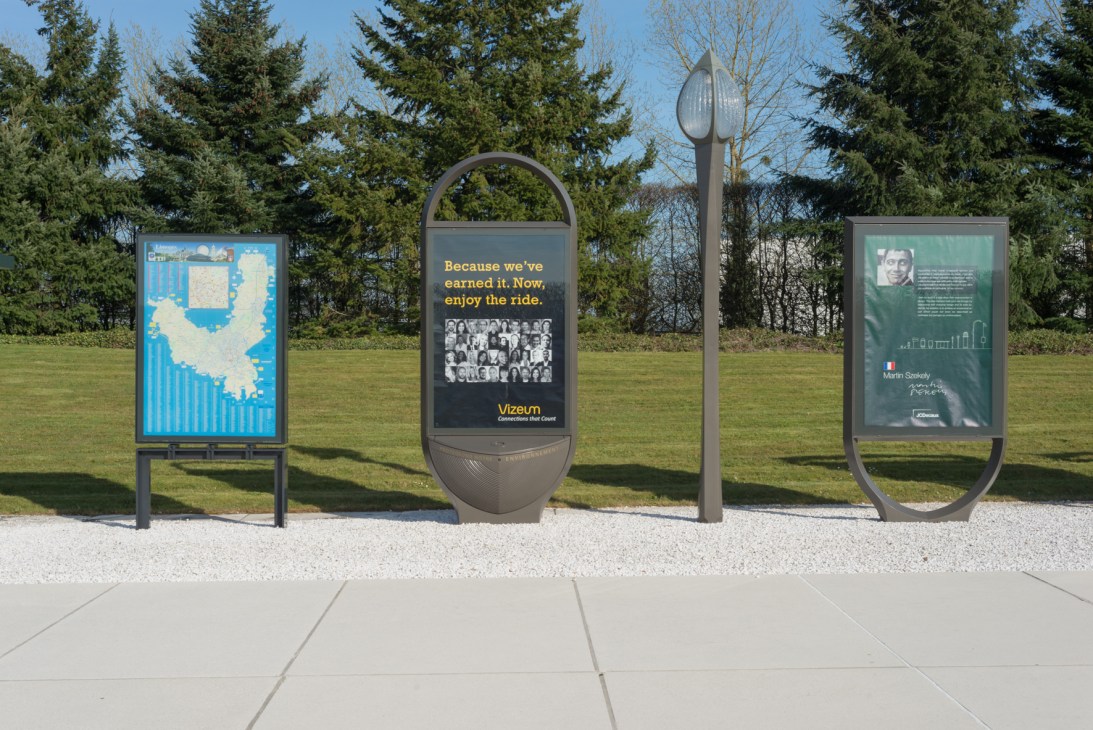 JCDecaux street furniture designs including poster boards and a sculptural lamp post displayed outdoors.