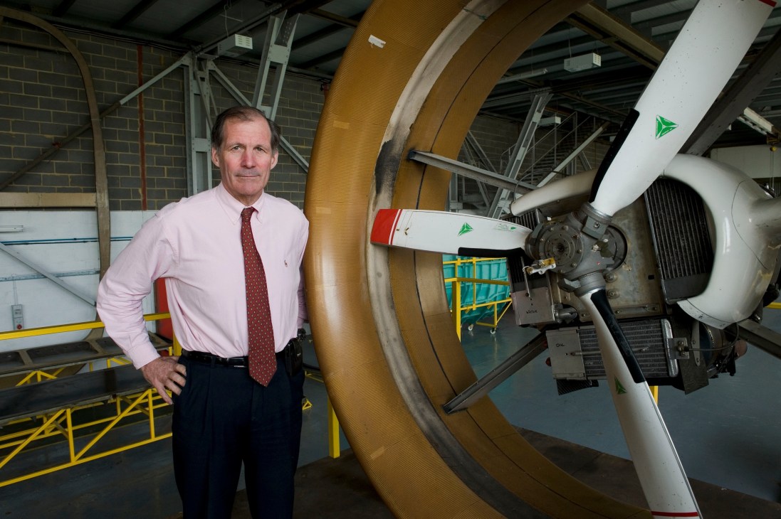 Gordon Taylor, director of Hybrid Air Vehicles, stands beside the demonstrator airship in the hangar at Cardington.