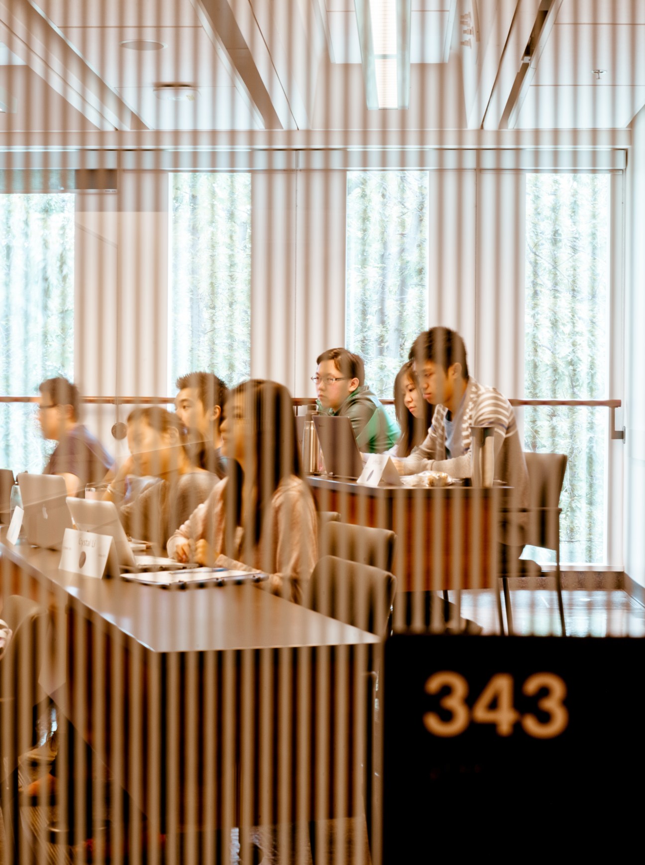Students seated at a long table during a Commercial Law class at Sauder School of Business.