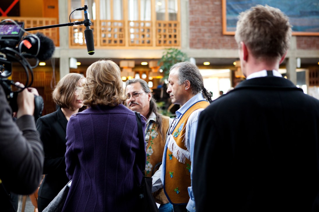 Arctic Athabaskan Council members being interviewed outside Kiruna town hall with camera crew.
