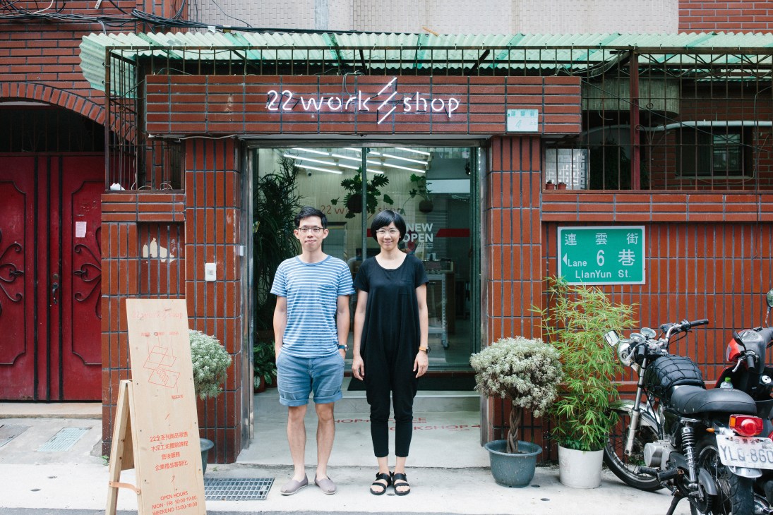 22 Design Studio owner Sean Yu and staff member standing in front of the red-brick storefront on LianYun Street in Taipei.