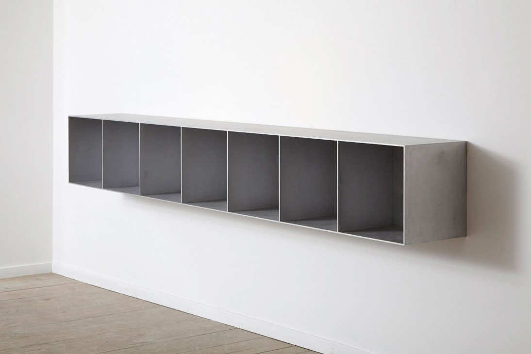 Sanded aluminium cabinet by Maarten van Severen with multiple compartments mounted on white wall.