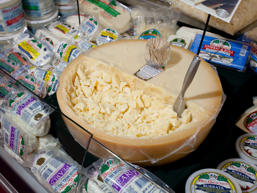 American Grana parmesan cheese displayed in a large wheel at the International Pizza Expo.