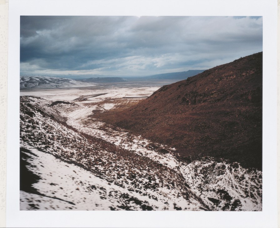 Snowy mountainous landscape with valley and frozen terrain near Tatvan, Anatolia.