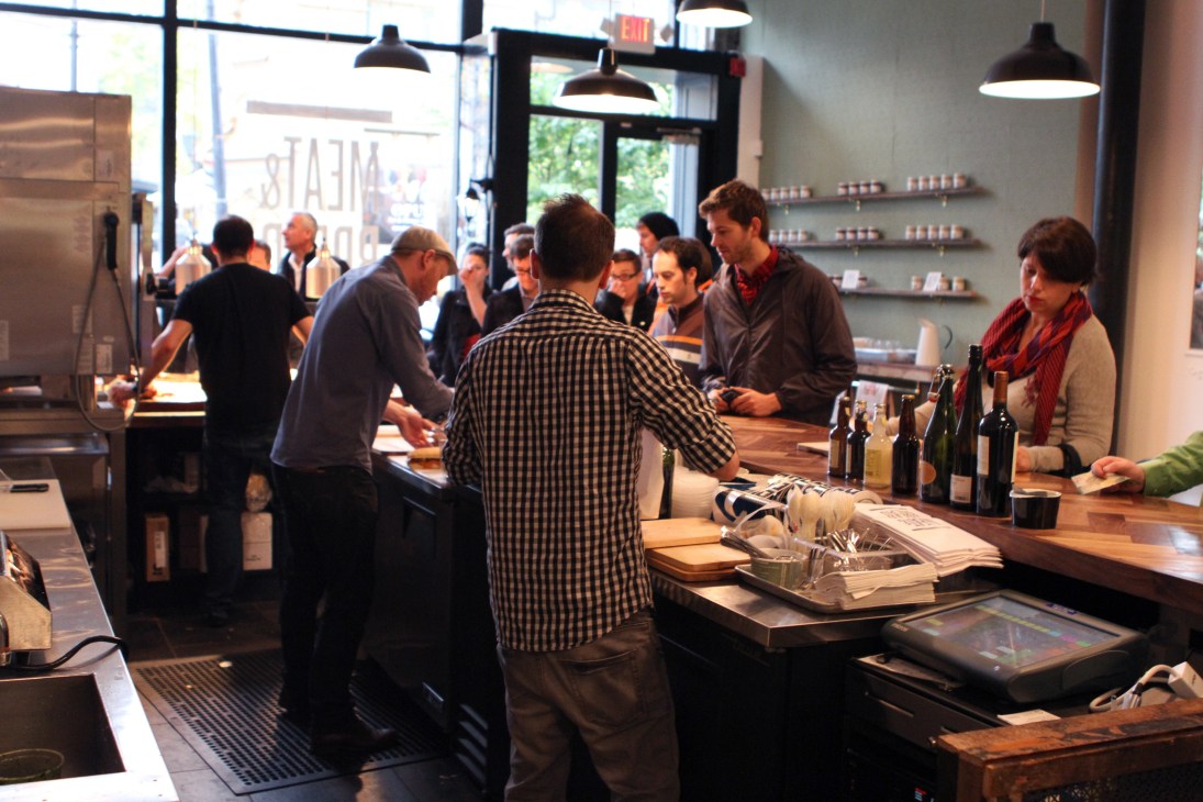 Customers queue at the counter inside Meat & Bread restaurant in Vancouver.