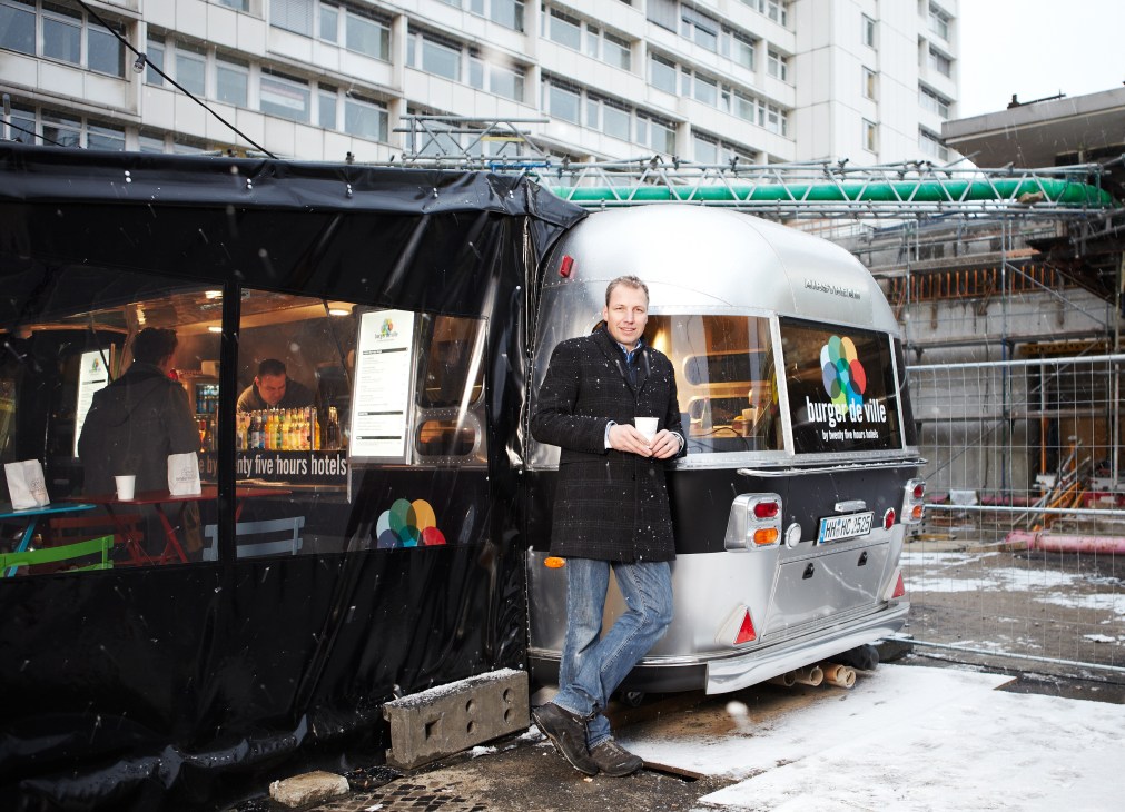 Chef Jürgen Klümpen stands outside the Burger de Ville Airstream mobile kitchen in Berlin.
