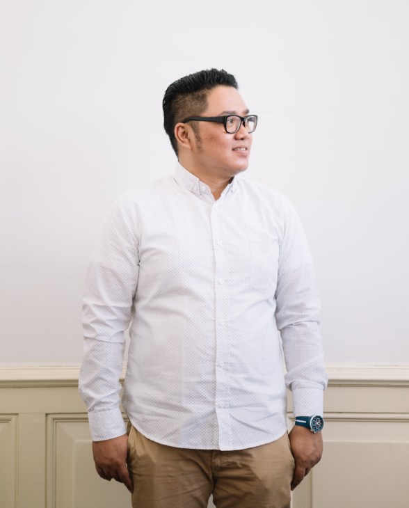 Iman Krestian of Cipta Karya Department of Public Works wearing glasses and white shirt