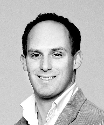 Black and white headshot of Michael Booth, automotive journalist and expert on Japanese K-cars.